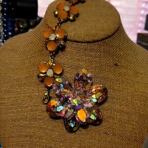 High fashion gold tone pink and white crystal bracelet with a pink brooch